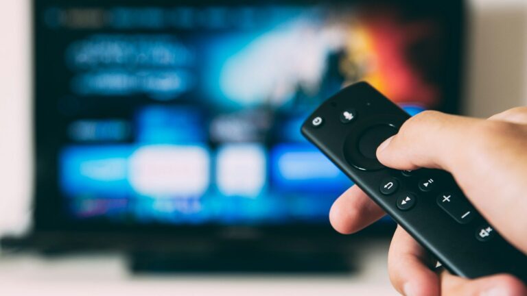 turned-on flat screen television