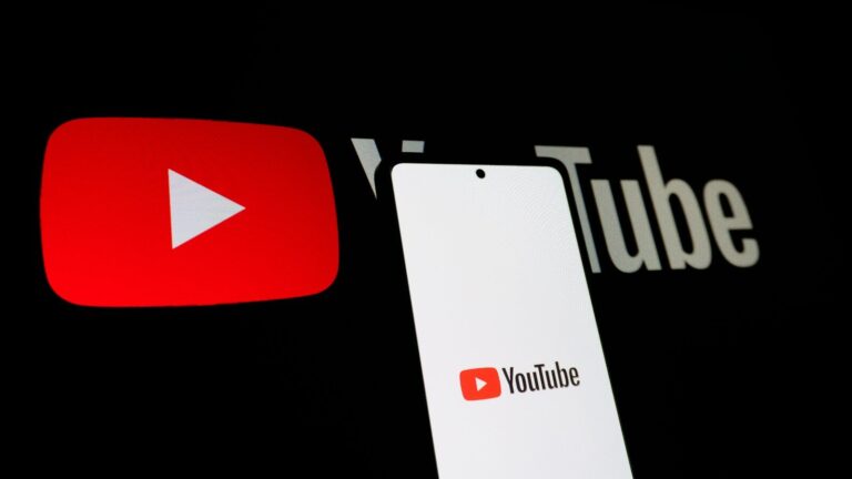 Smartphone displaying youtube logo next to youtube logo