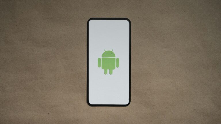 a cell phone with a green icon on it