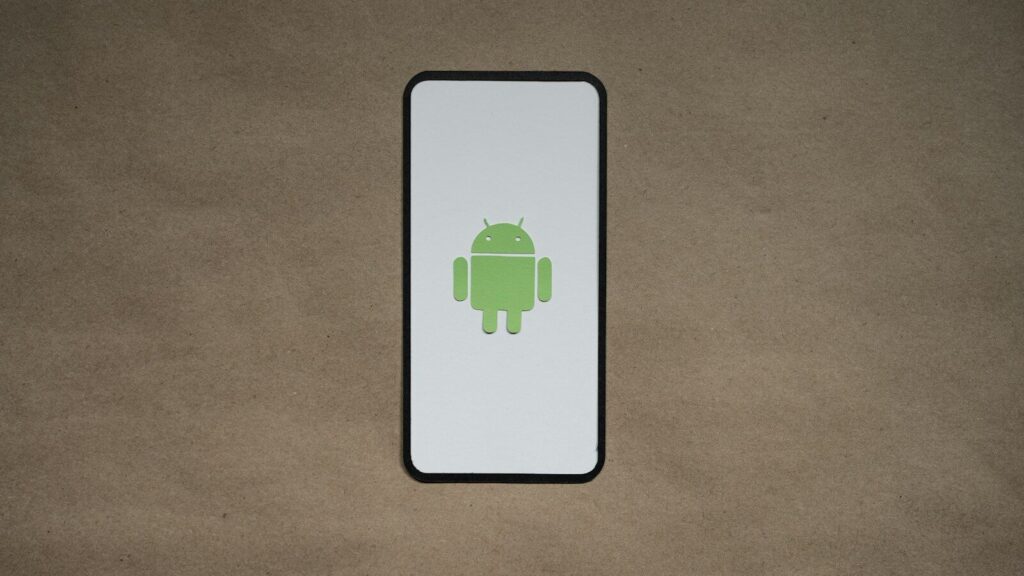 a cell phone with a green icon on it