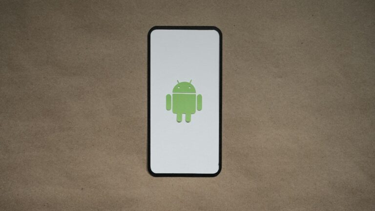 a cell phone with a green icon on it