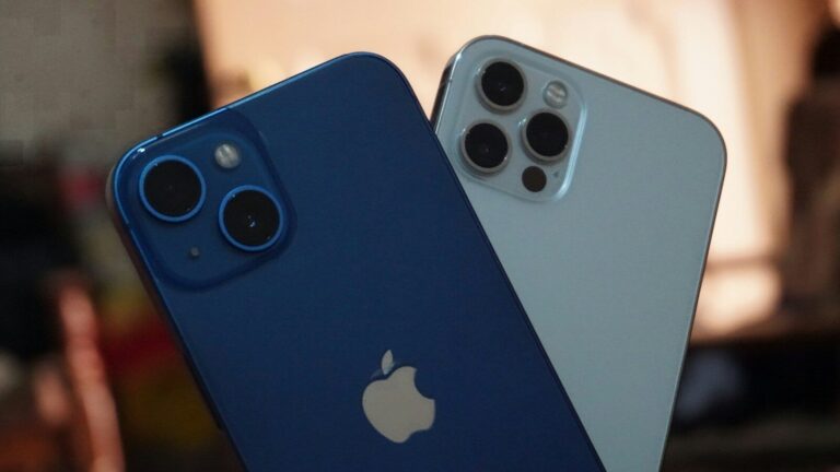 two blue and white iphones sitting next to each other