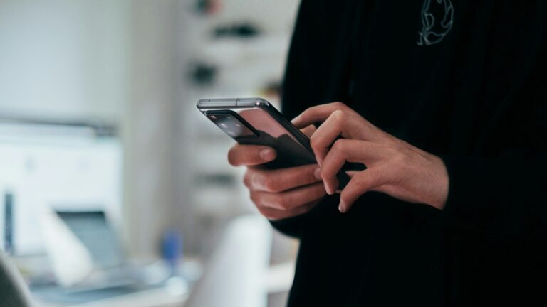 person holding black android smartphone