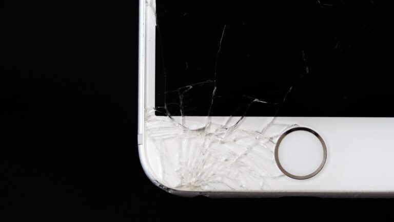 Detailed image of a cracked smartphone screen highlighting damage to the device.