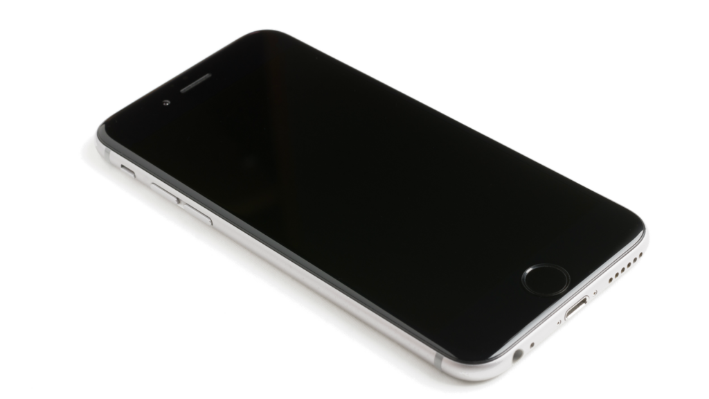 A modern smartphone with a blank screen lying on a white surface, showcasing sleek design.