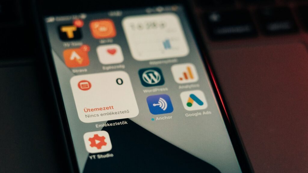 Close-up view of smartphone screen featuring various app icons and notifications.