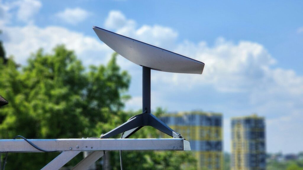 a white surfboard sitting on top of a metal pole
