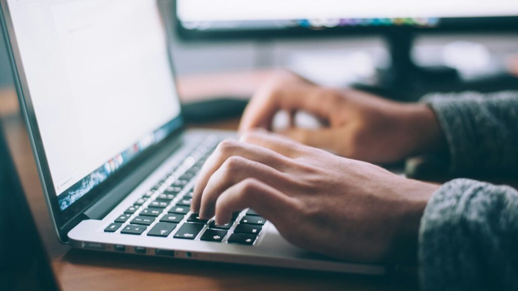 person using MacBook Pro