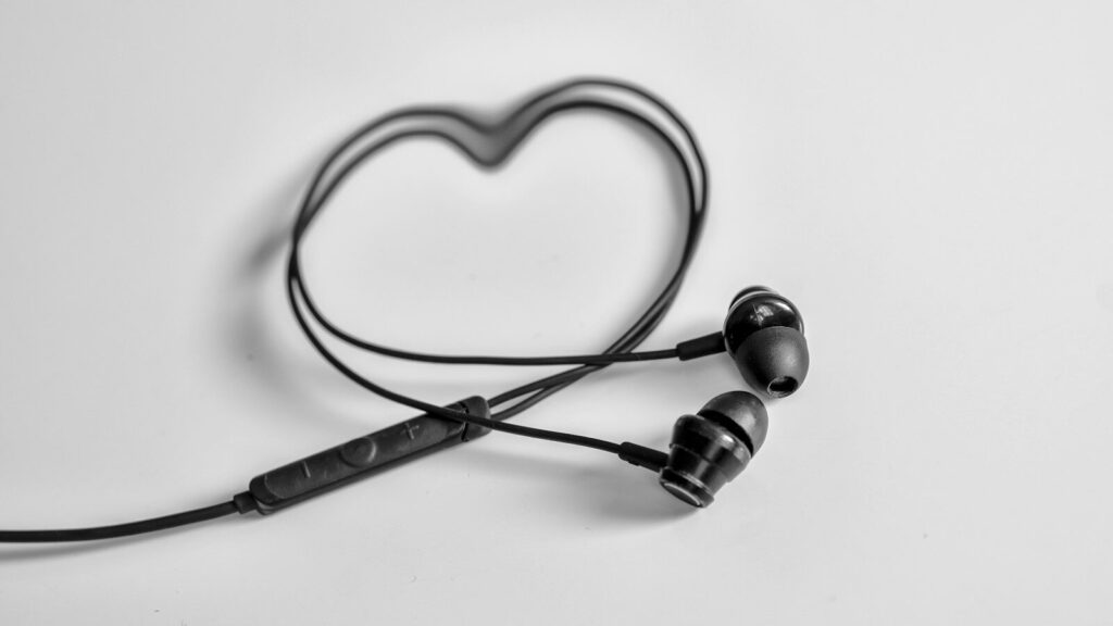a pair of ear buds sitting on top of a table