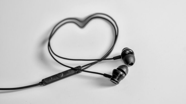 a pair of ear buds sitting on top of a table