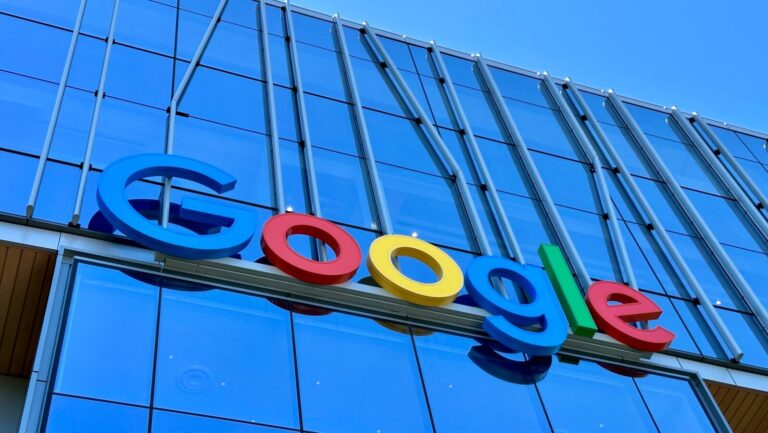 the google logo is displayed on the side of a building