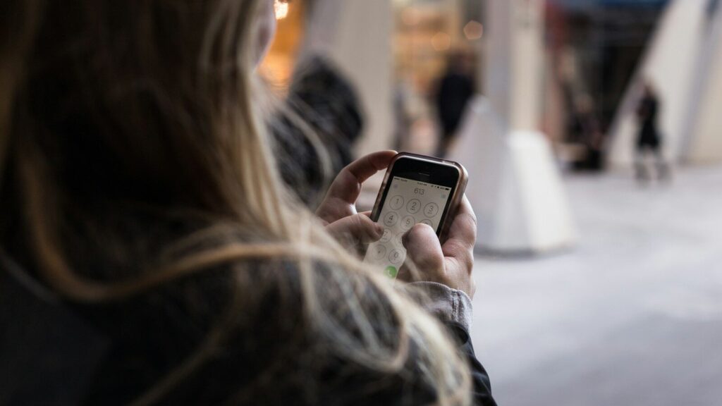 person unlocking smartphone
