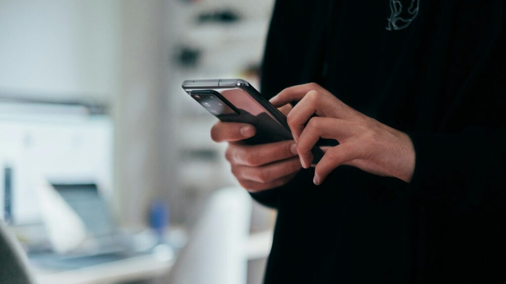person holding black android smartphone