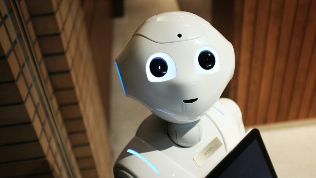 white robot near brown wall