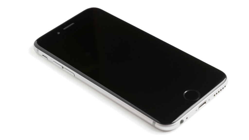 A modern smartphone with a blank screen lying on a white surface, showcasing sleek design.