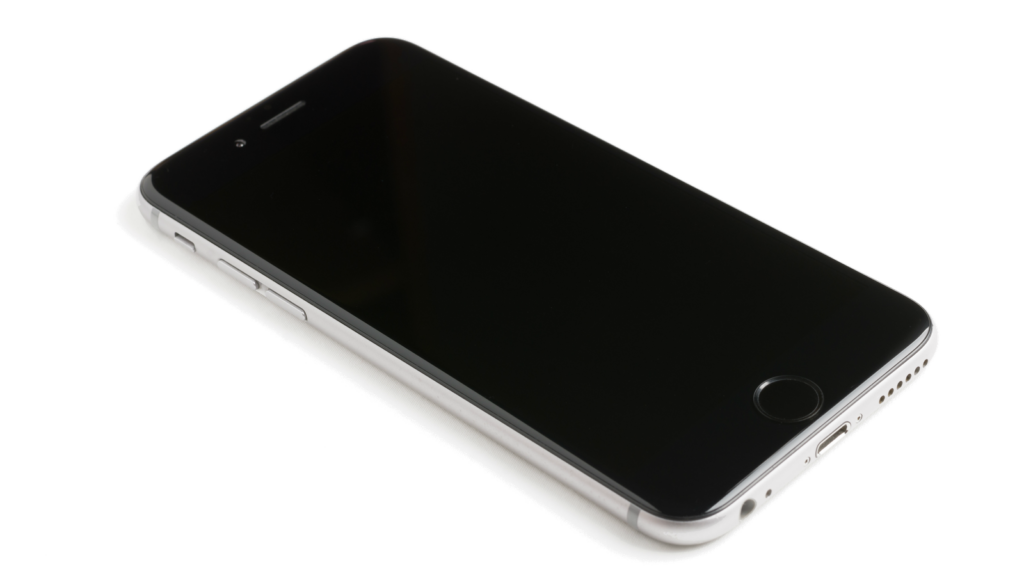 A modern smartphone with a blank screen lying on a white surface, showcasing sleek design.