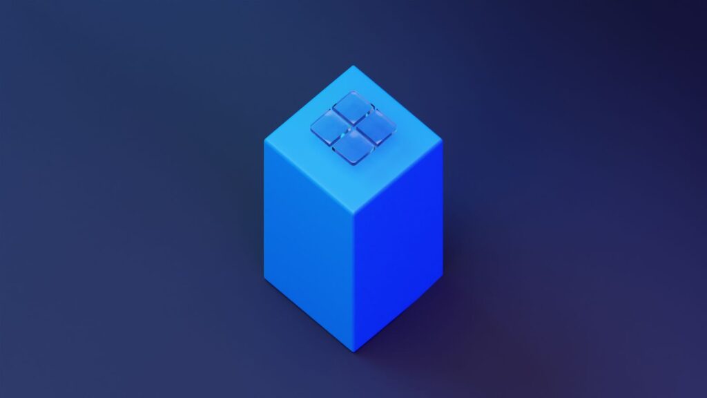 Geometric 3D render of a blue cube with glass panels on top, against a blue background.