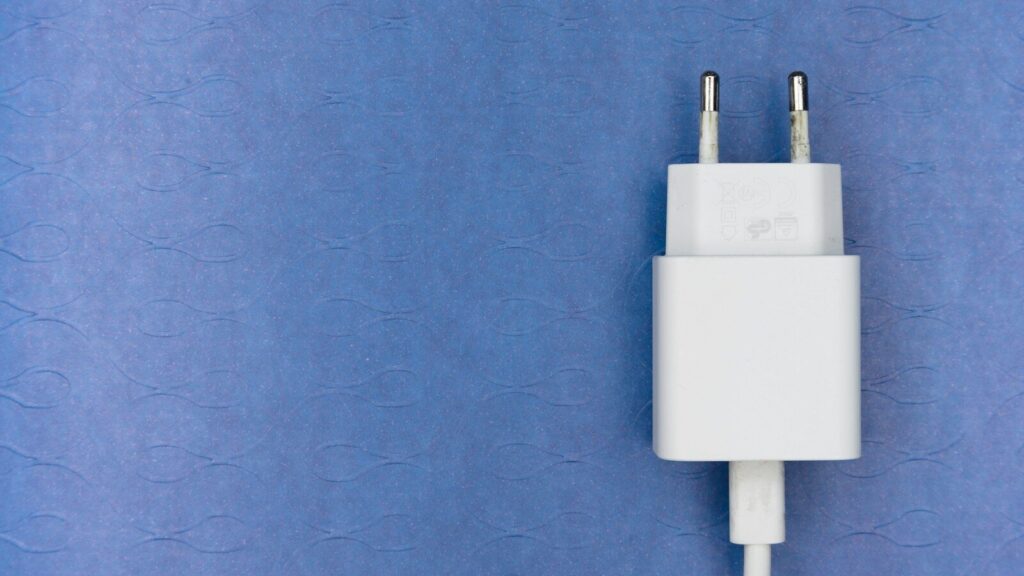white adapter on purple textile
