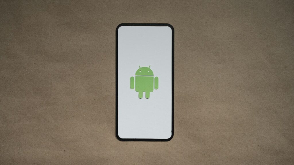 a cell phone with a green icon on it