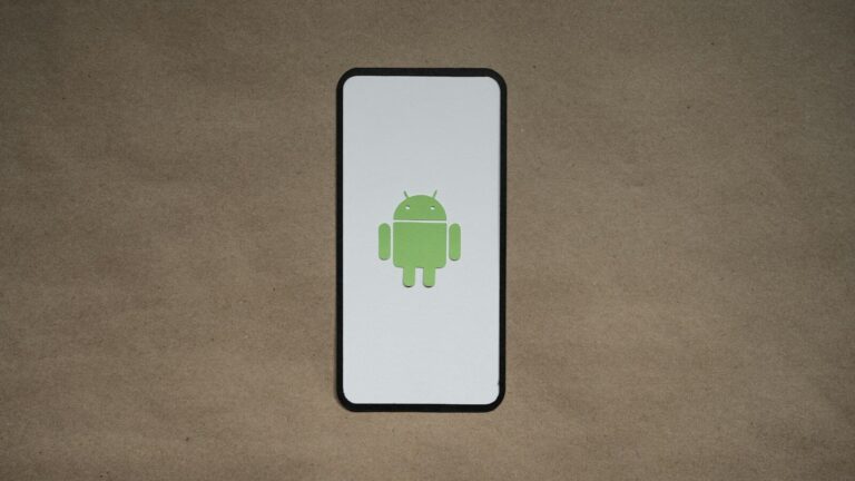 a cell phone with a green icon on it