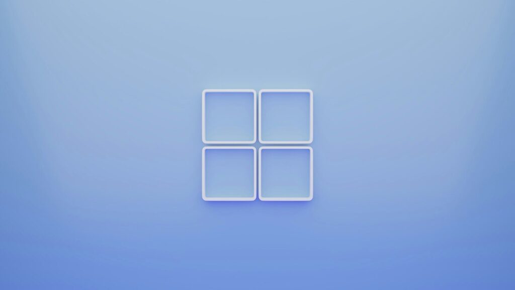 Four white square frames arranged in a grid on a soft blue background