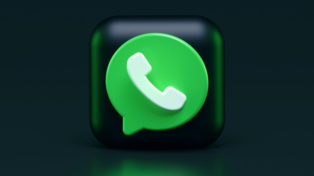 A green speech bubble icon with a white telephone handset on a dark background