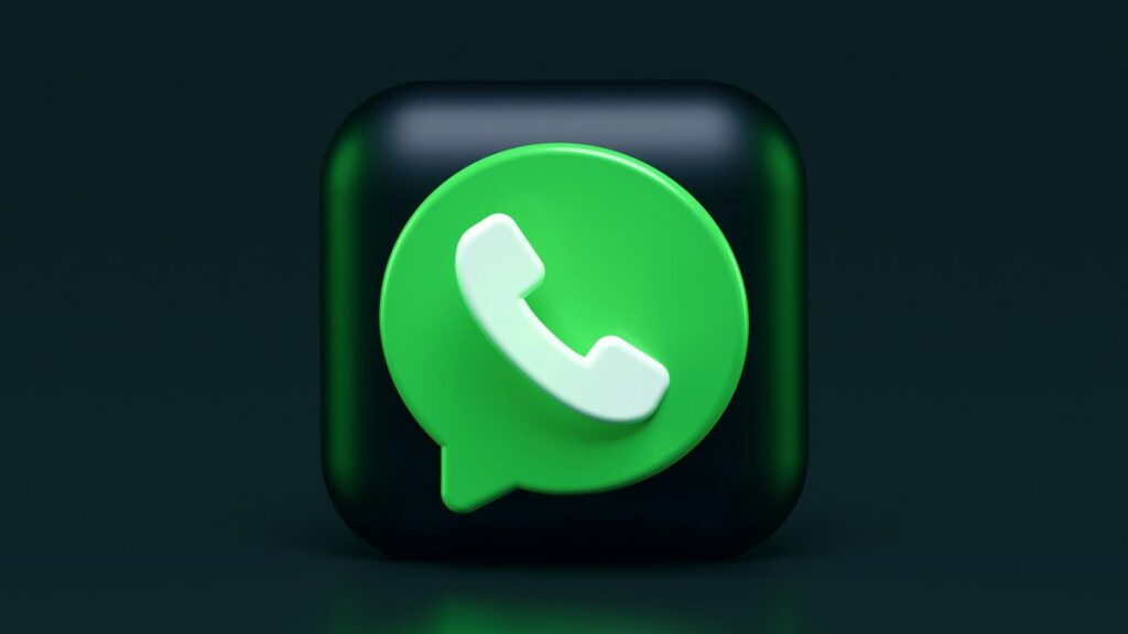A green speech bubble icon with a white telephone handset on a dark background