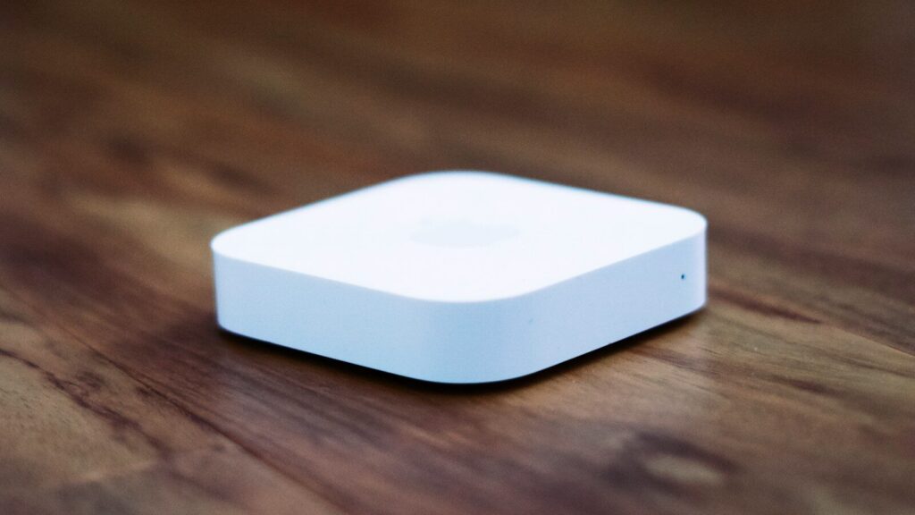 white apple tv on brown wooden table