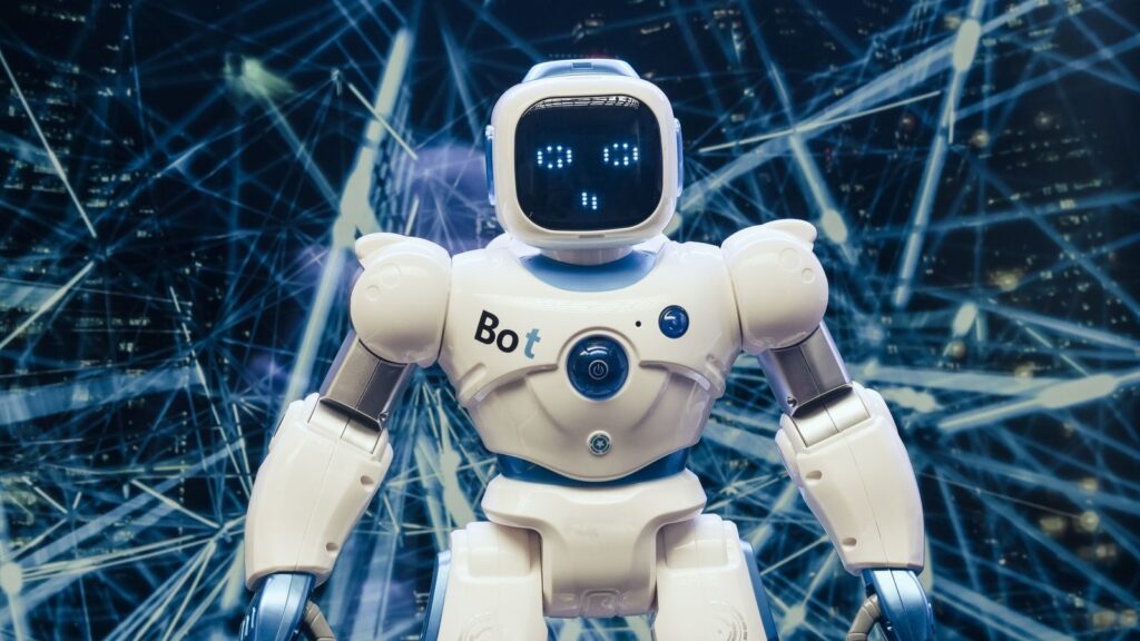 A modern humanoid robot with luminous features set against a digital network backdrop.