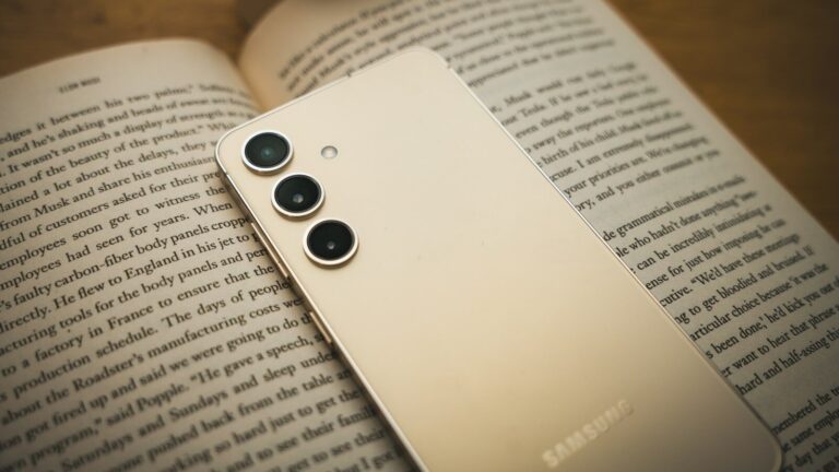 a close up of a cell phone on a book