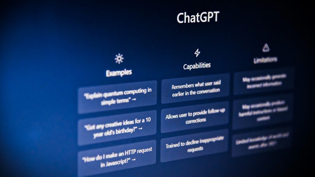 The ChatGPT interface showing examples, capabilities, and limitations on a dark blue screen