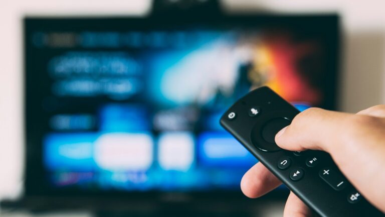 turned-on flat screen television