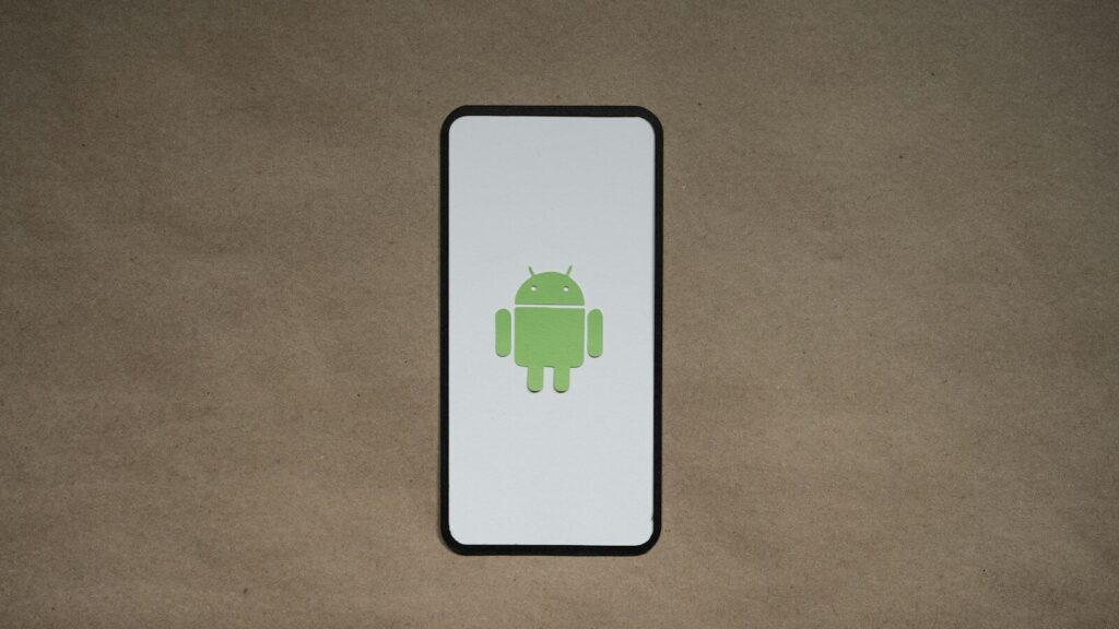 a cell phone with a green icon on it