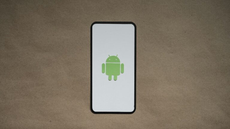 a cell phone with a green icon on it