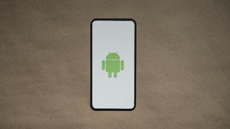 a cell phone with a green icon on it